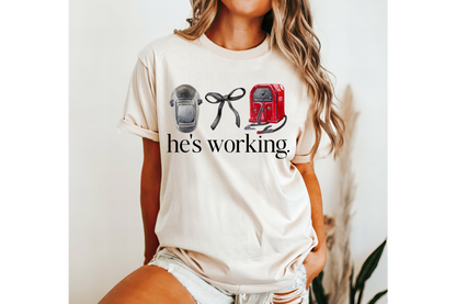 HE'S WORKING WELDER tee